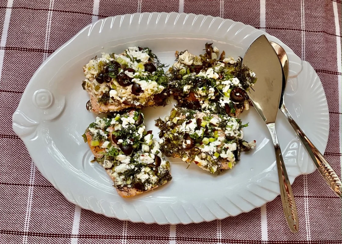 Baked Salmon on a plate with two spoons